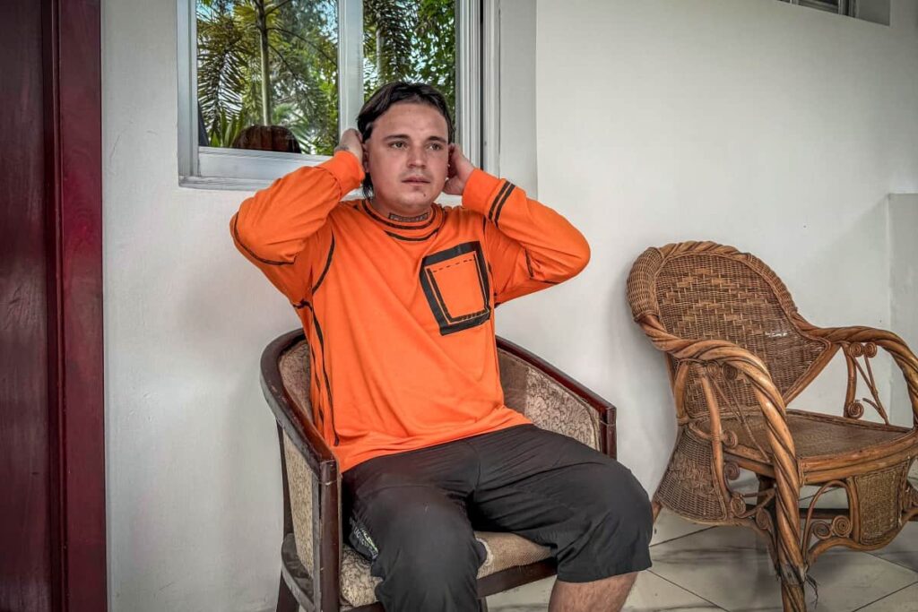 Hugo Palencia Ropero, 25 years old, a Colombian citizen expelled from the United States, sits outside his room in a hotel in Kinshasa, Democratic Republic of the Congo, on April 22, 2026. PHOTO: AFP/ GLODY MURHABAZI