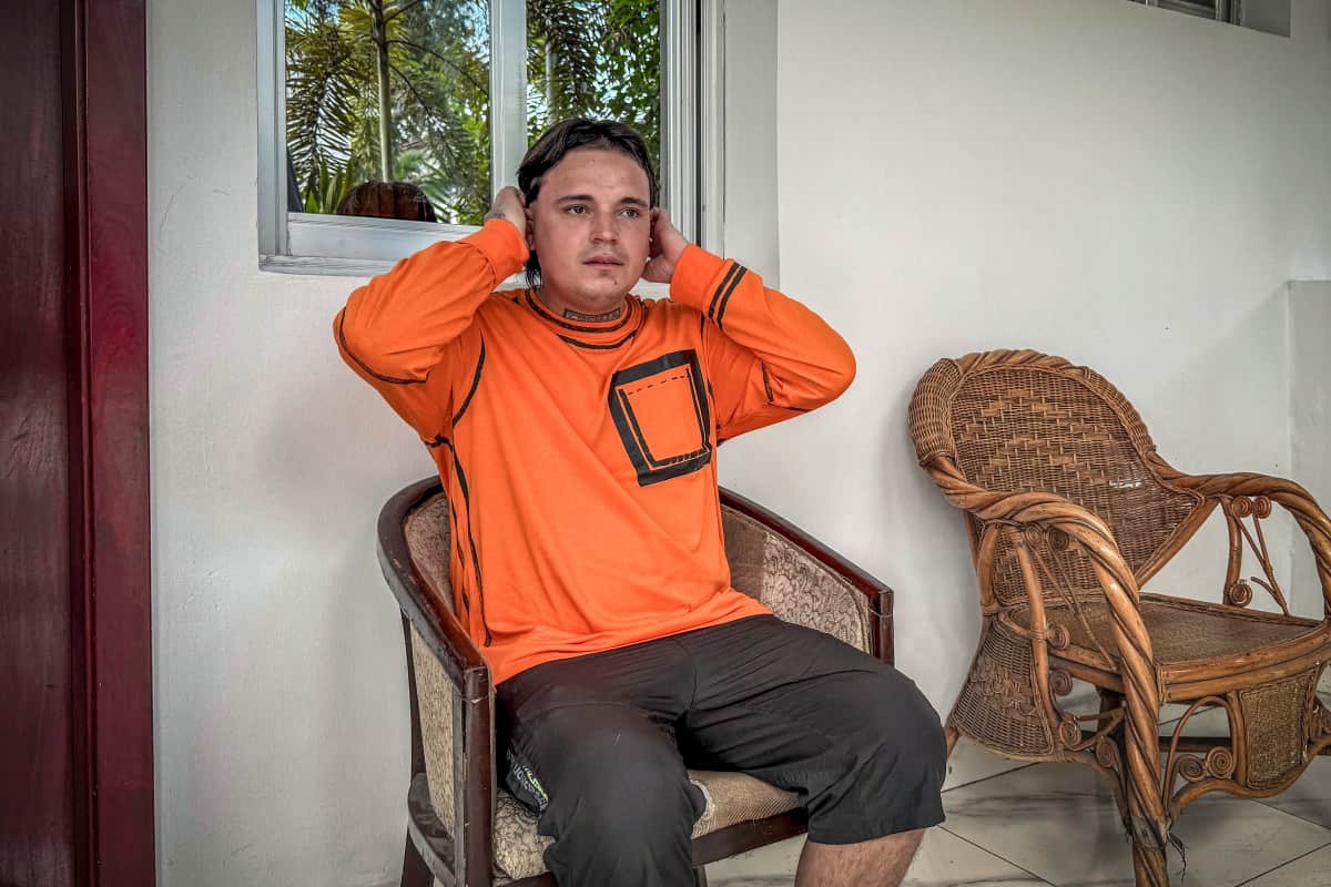 Hugo Palencia Ropero, 25 years old, a Colombian citizen expelled from the United States, sits outside his room in a hotel in Kinshasa, Democratic Republic of the Congo, on April 22, 2026. PHOTO: AFP/ GLODY MURHABAZI