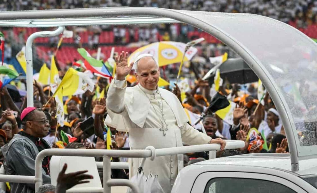 Pope Leo XIV (C) waves at the crowd from the Popemobile as he arrives for a meeting with young people and families at Bata Stadium in Bata on the tenth day of an 11-day apostolic journey to Africa, on April 22, 2026. PHOTO: AFP/ ALBERTO PIZZOLI