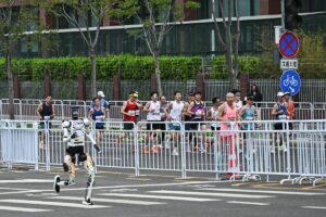 A robot runs in the second Beijing E-Town Half Marathon and Humanoid Half Marathon in Beijing on April 19, 2026. PHOTO: AFP/ PEDRO PARDO