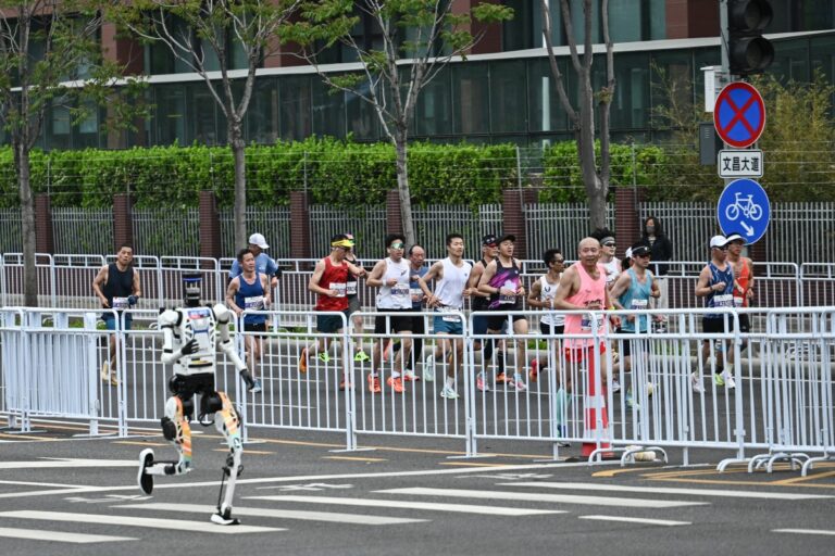 A robot runs in the second Beijing E-Town Half Marathon and Humanoid Half Marathon in Beijing on April 19, 2026. PHOTO: AFP/ PEDRO PARDO