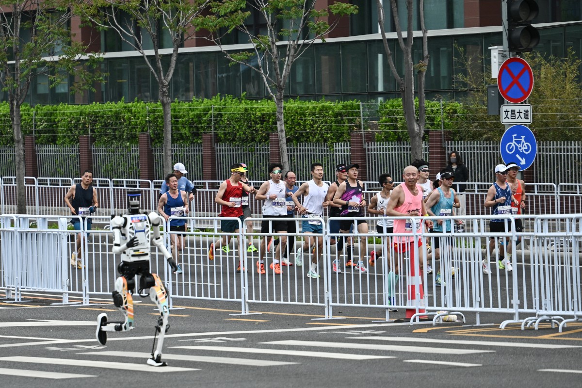 A robot runs in the second Beijing E-Town Half Marathon and Humanoid Half Marathon in Beijing on April 19, 2026. PHOTO: AFP/ PEDRO PARDO